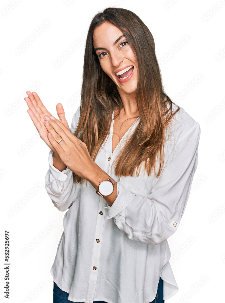 Young beautiful woman wearing casual clothes clapping and applauding happy and joyful, smiling proud hands together Young beautiful woman wearing casual clothes clapping and applauding happy and joyful, smiling proud hands together