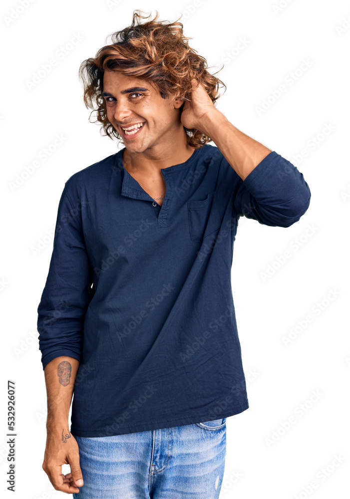 Young hispanic man wearing casual clothes smiling with hand over ear listening an hearing to rumor or gossip. deafness concept. Young hispanic man wearing casual clothes smiling with hand over ear listening an hearing to rumor or gossip. deafness concept.