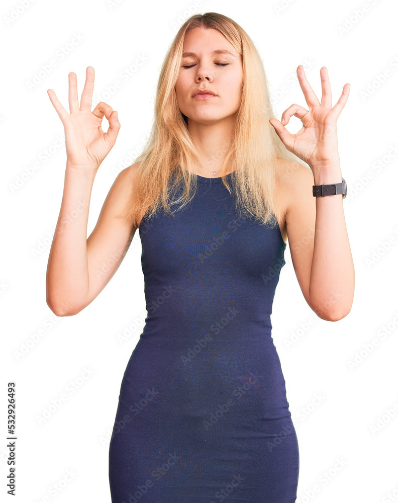 Young beautiful blonde woman wearing casual dress relax and smiling with eyes closed doing meditation gesture with fingers. yoga concept. Young beautiful blonde woman wearing casual dress relax and smiling with eyes closed doing meditation gesture with fingers. yoga concept.