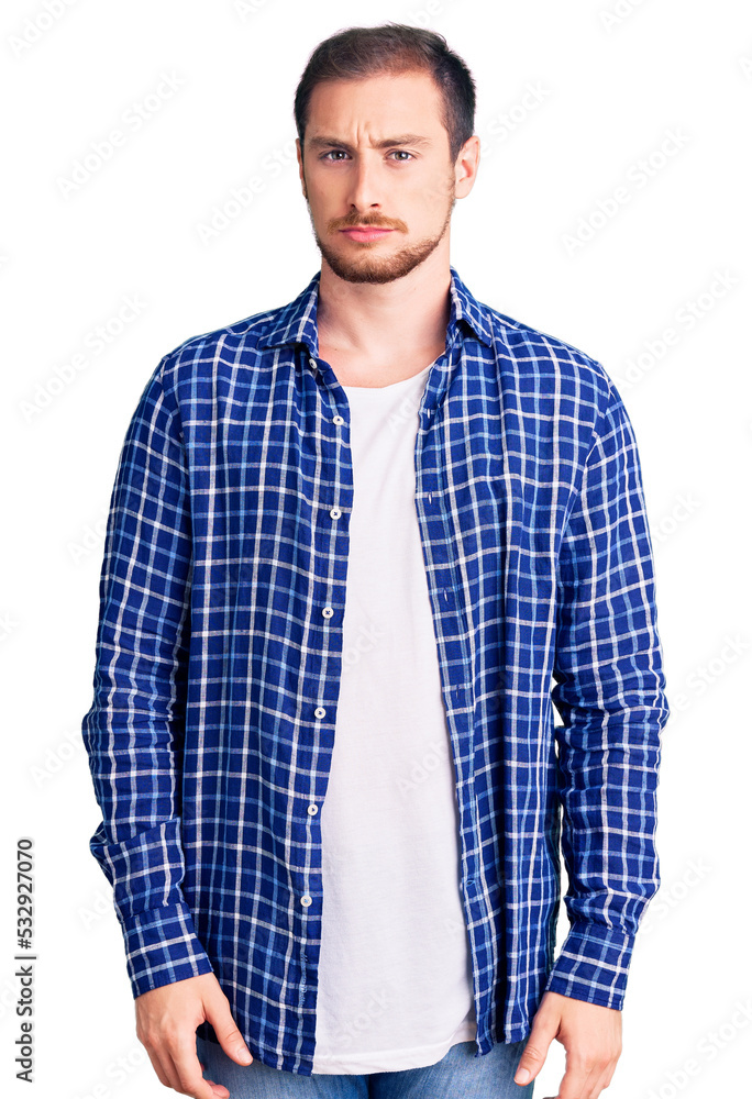 Young handsome caucasian man wearing casual clothes skeptic and nervous, frowning upset because of problem. negative person.