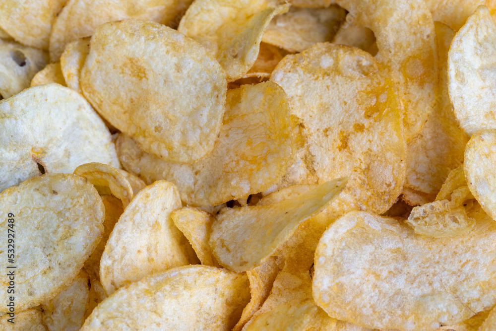 scattered potato chips with natural spices scattered potato chips with natural spices