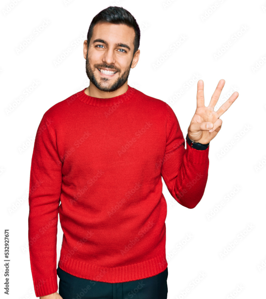 Young hispanic man wearing casual clothes showing and pointing up with fingers number three while smiling confident and happy. Young hispanic man wearing casual clothes showing and pointing up with fingers number three while smiling confident and happy.