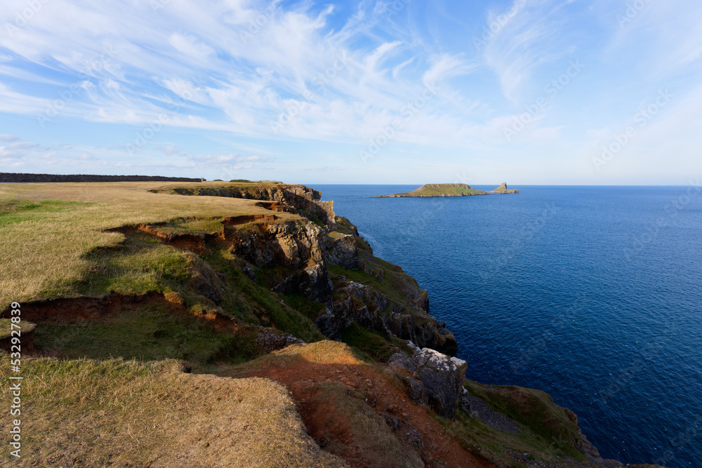 Over Rhossili clifftops to Worms Head. Over Rhossili clifftops to Worms Head.