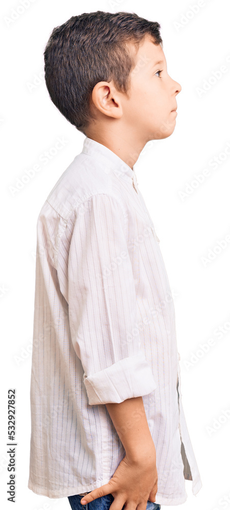 Cute blond kid wearing elegant shirt looking to side, relax profile pose with natural face and confident smile. Cute blond kid wearing elegant shirt looking to side, relax profile pose with natural face and confident smile.