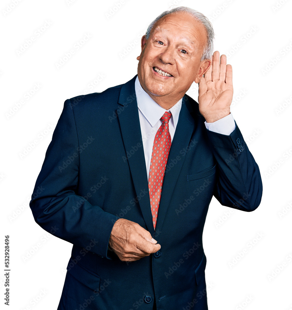Senior man with grey hair wearing business suit and tie smiling with hand over ear listening and hearing to rumor or gossip. deafness concept. Senior man with grey hair wearing business suit and tie smiling with hand over ear listening and hearing to rumor or gossip. deafness concept.