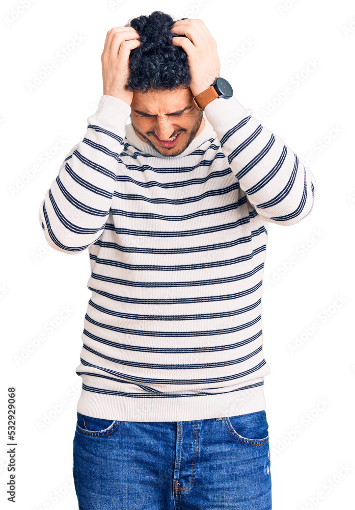 Young hispanic man wearing casual clothes suffering from headache desperate and stressed because pain and migraine. hands on head. Young hispanic man wearing casual clothes suffering from headache desperate and stressed because pain and migraine. hands on head.