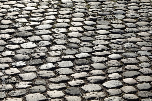 road pavement made with many smooth pebbles without people