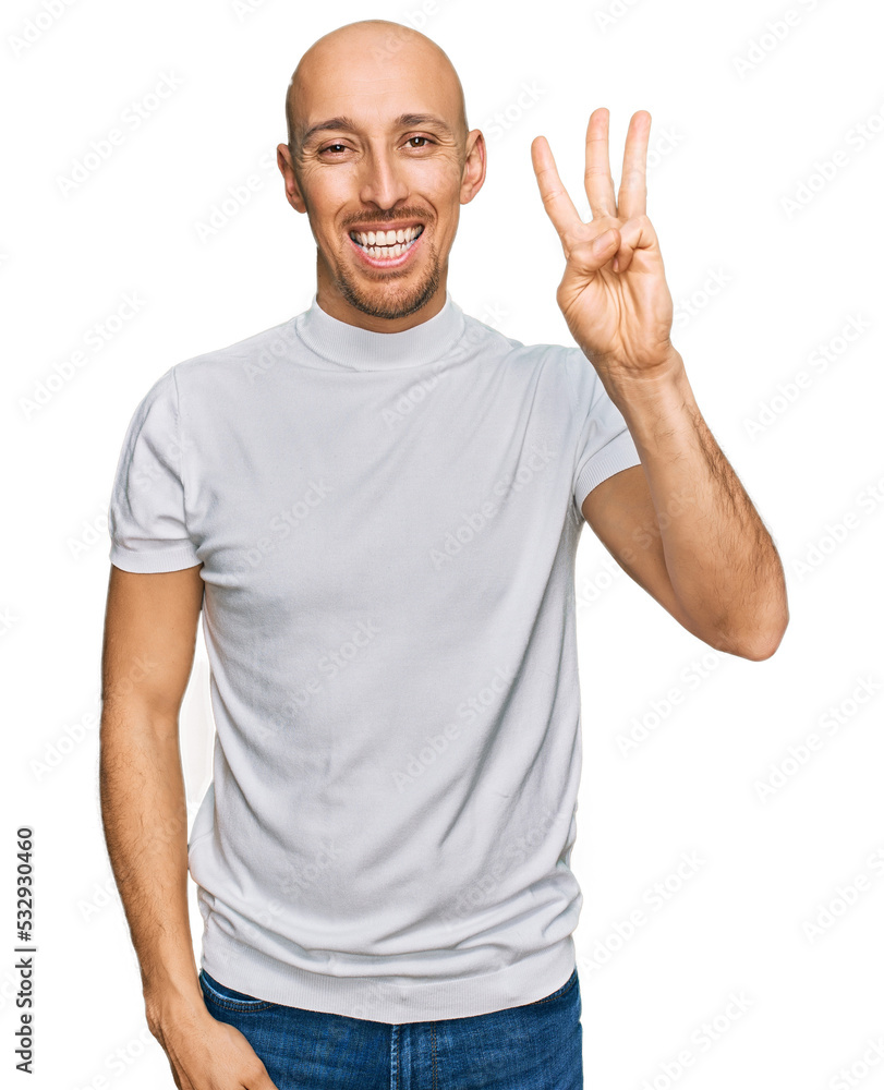 Bald man with beard wearing casual white t shirt showing and pointing up with fingers number three while smiling confident and happy. Bald man with beard wearing casual white t shirt showing and pointing up with fingers number three while smiling confident and happy.