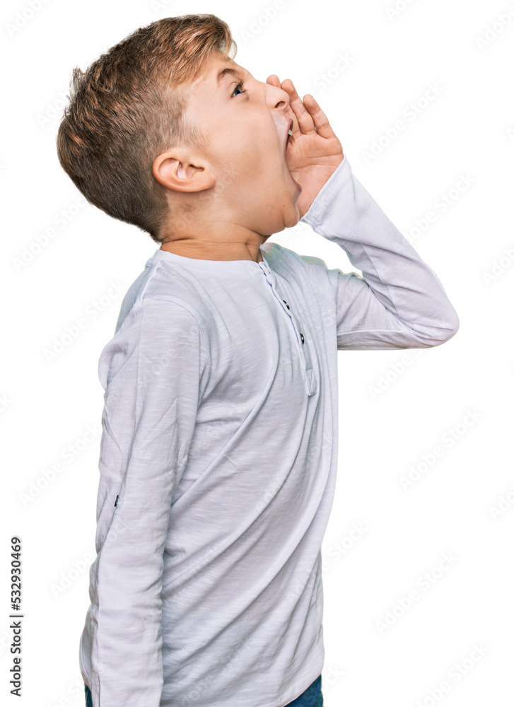 Little caucasian boy kid wearing casual clothes shouting and screaming loud to side with hand on mouth. communication concept. Little caucasian boy kid wearing casual clothes shouting and screaming loud to side with hand on mouth. communication concept.