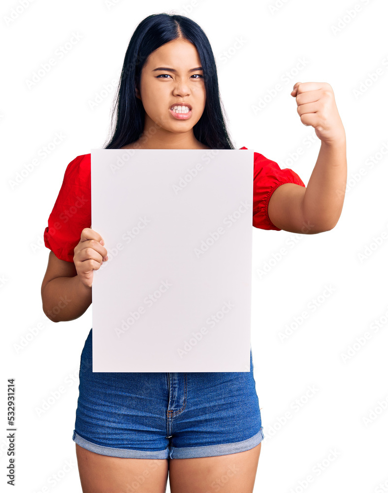 Young beautiful asian girl holding blank empty banner annoyed and frustrated shouting with anger, yelling crazy with anger and hand raised Young beautiful asian girl holding blank empty banner annoyed and frustrated shouting with anger, yelling crazy with anger and hand raised