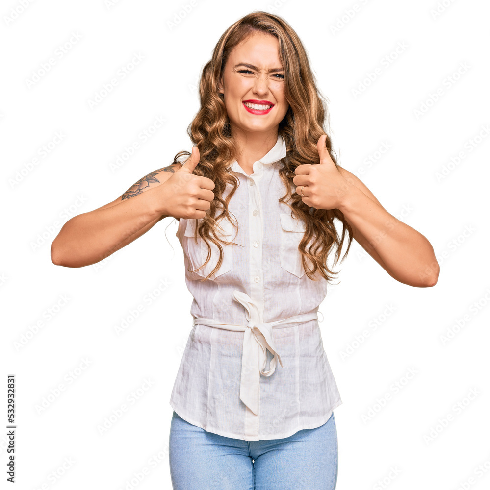 Young blonde girl wearing casual clothes success sign doing positive gesture with hand, thumbs up smiling and happy. cheerful expression and winner gesture. Young blonde girl wearing casual clothes success sign doing positive gesture with hand, thumbs up smiling and happy. cheerful expression and winner gesture.