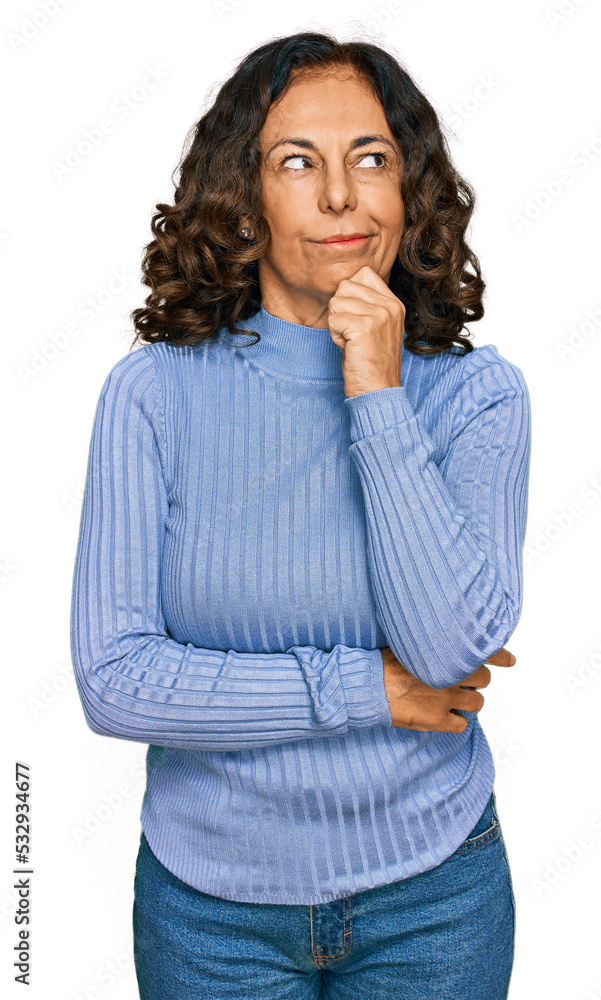 Middle age hispanic woman wearing casual clothes serious face thinking about question with hand on chin, thoughtful about confusing idea Middle age hispanic woman wearing casual clothes serious face thinking about question with hand on chin, thoughtful about confusing idea