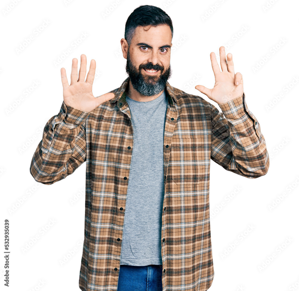 Hispanic man with beard wearing casual shirt showing and pointing up with fingers number nine while smiling confident and happy. Hispanic man with beard wearing casual shirt showing and pointing up with fingers number nine while smiling confident and happy.