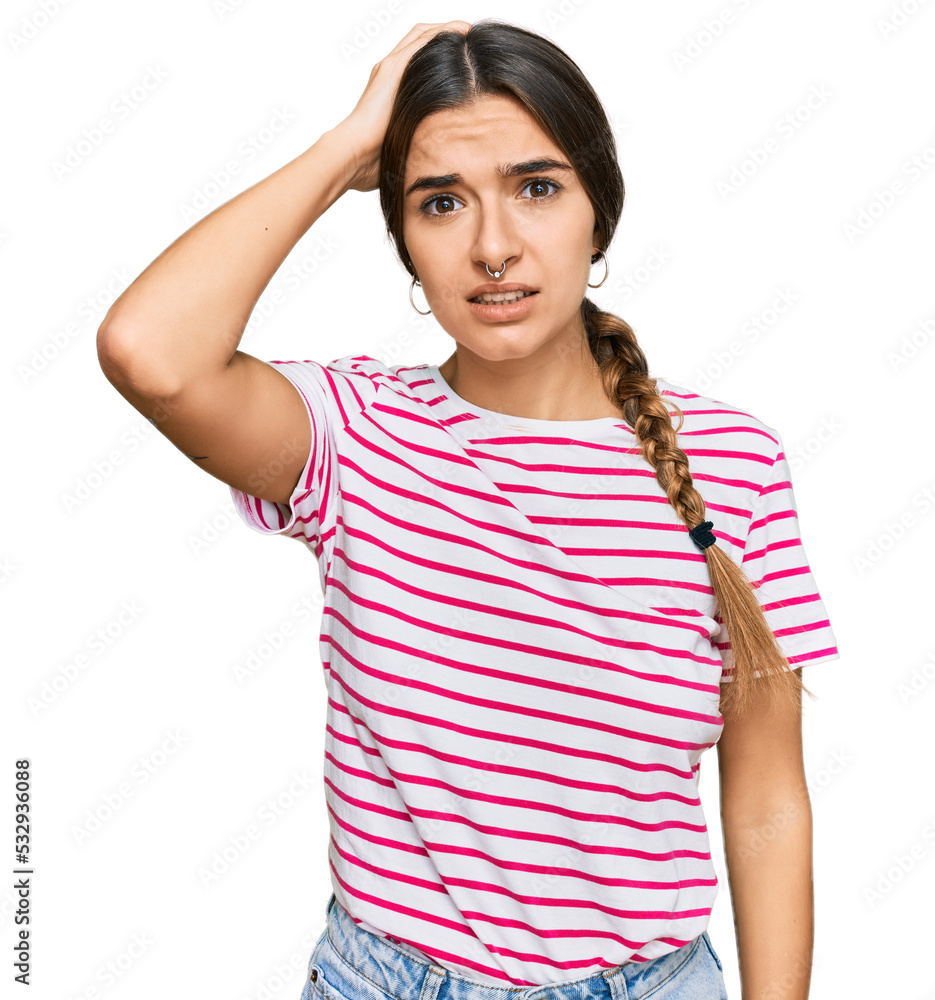 Young hispanic woman wearing casual clothes confuse and wonder about question. uncertain with doubt, thinking with hand on head. pensive concept. Young hispanic woman wearing casual clothes confuse and wonder about question. uncertain with doubt, thinking with hand on head. pensive concept.