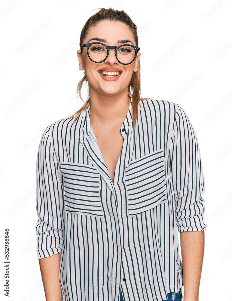 Young caucasian woman wearing business shirt and glasses with a happy and cool smile on face. lucky person. Young caucasian woman wearing business shirt and glasses with a happy and cool smile on face. lucky person.