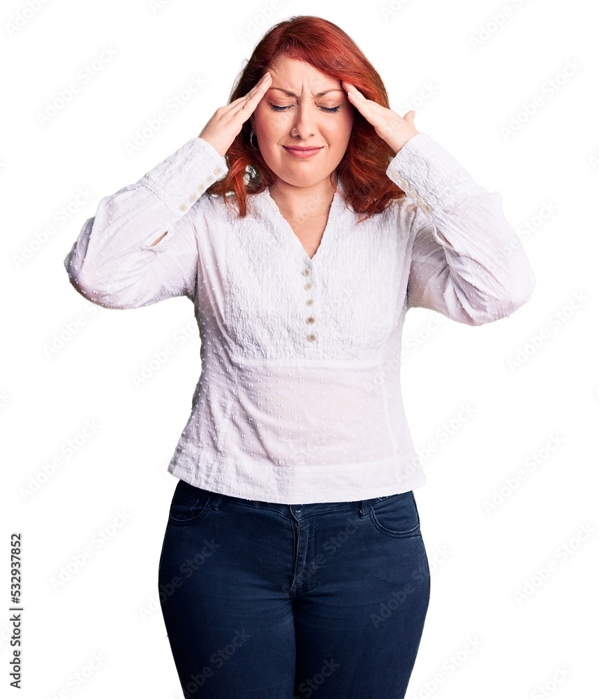 Young beautiful redhead woman wearing casual shirt suffering from headache desperate and stressed because pain and migraine. hands on head. Young beautiful redhead woman wearing casual shirt suffering from headache desperate and stressed because pain and migraine. hands on head.