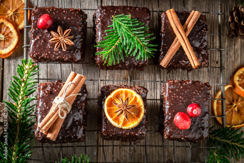 Gingerbread cubes with chocolate glaze and dried fruits for Christmas