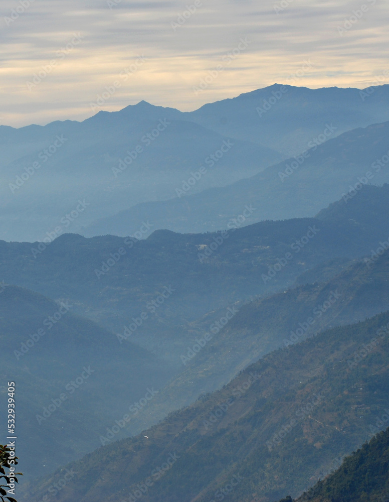 A fascinating view of horizons after horizons layers looks mesmerizing as seen from Temi Tea Estate near Damthang in South Sikkim.