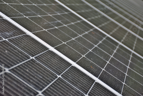 Installation of photovoltaic panels. Macro photography and perspective of the panels and cells. Self-consumption concept.