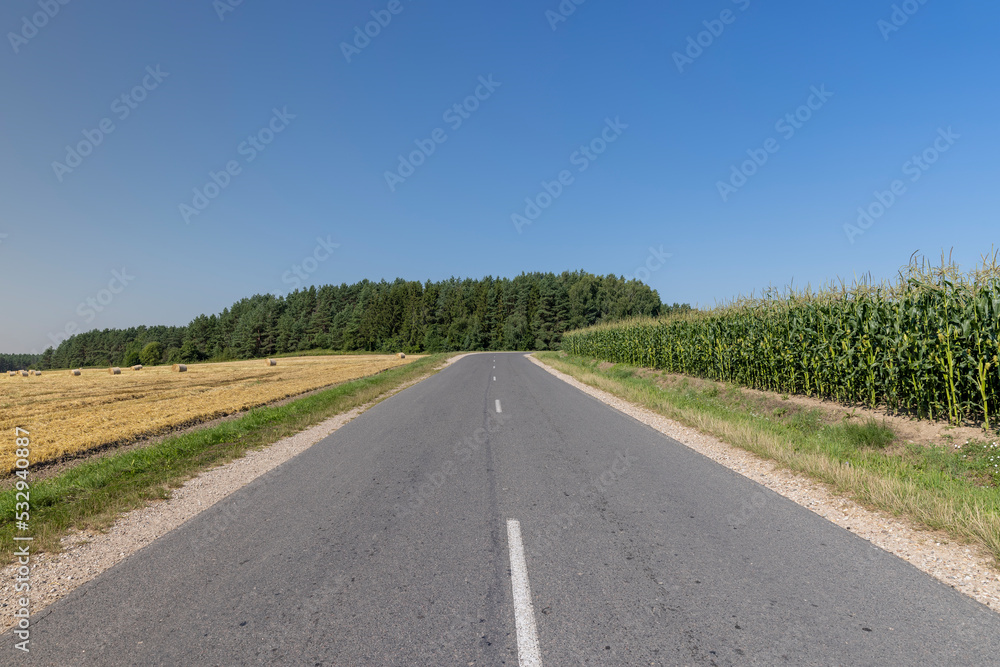 A straight road made of asphalt