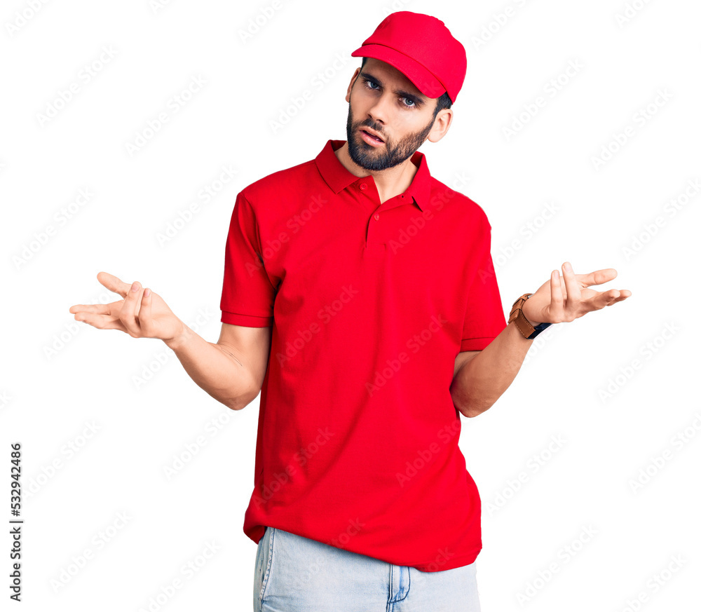 Young handsome man with beard wearing delivery uniform clueless and confused with open arms, no idea concept. Young handsome man with beard wearing delivery uniform clueless and confused with open arms, no idea concept.