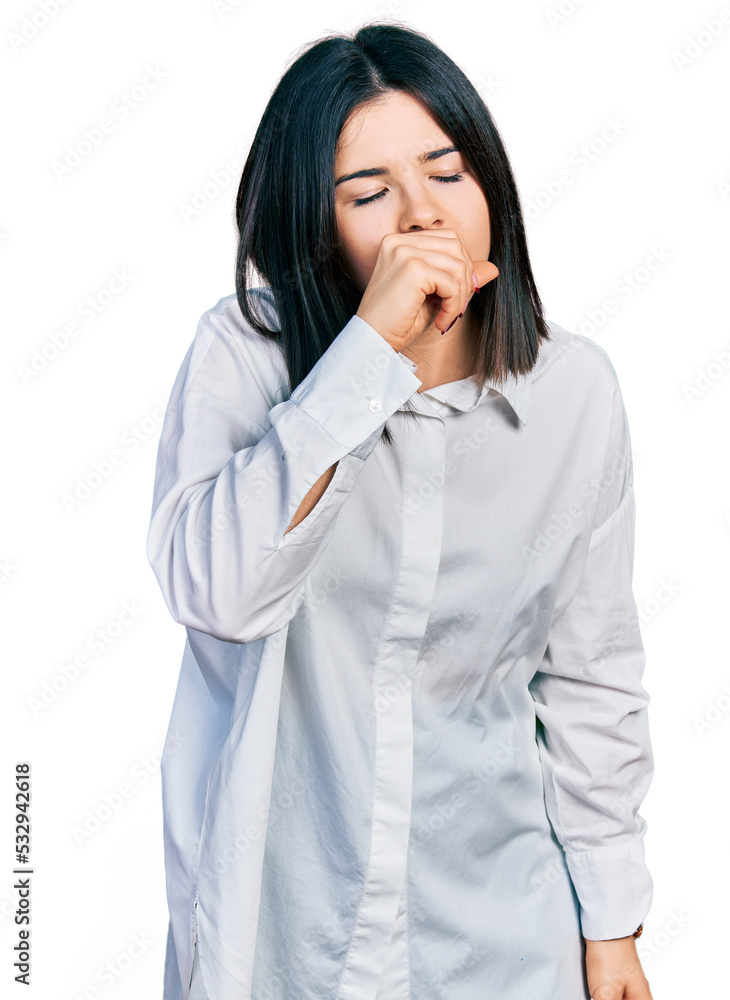Young brunette woman with blue eyes wearing oversize white shirt feeling unwell and coughing as symptom for cold or bronchitis. health care concept. Young brunette woman with blue eyes wearing oversize white shirt feeling unwell and coughing as symptom for cold or bronchitis. health care concept.