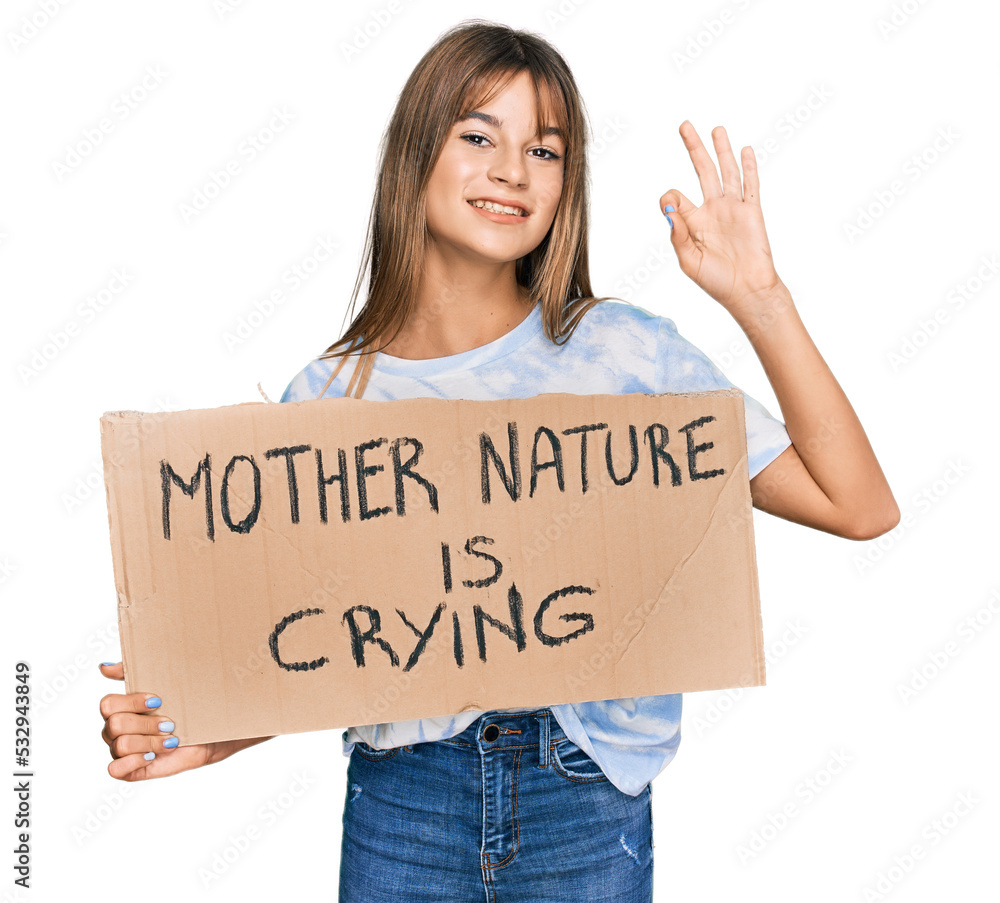 Teenager caucasian girl holding mother nature is crying protest cardboard banner doing ok sign with fingers, smiling friendly gesturing excellent symbol Teenager caucasian girl holding mother nature is crying protest cardboard banner doing ok sign with fingers, smiling friendly gesturing excellent symbol