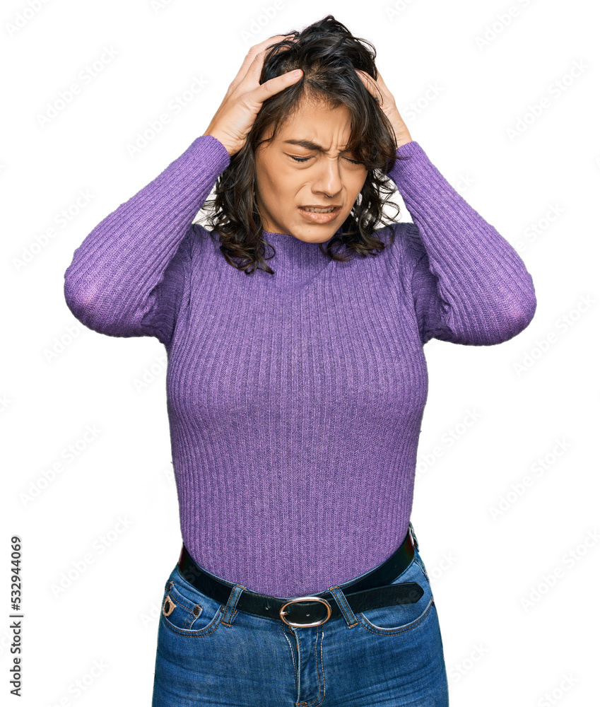 Young hispanic woman wearing casual clothes suffering from headache desperate and stressed because pain and migraine. hands on head. Young hispanic woman wearing casual clothes suffering from headache desperate and stressed because pain and migraine. hands on head.
