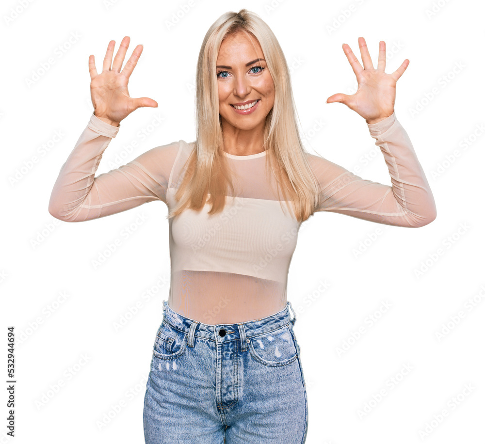 Young blonde woman wearing casual clothes showing and pointing up with fingers number ten while smiling confident and happy. Young blonde woman wearing casual clothes showing and pointing up with fingers number ten while smiling confident and happy.
