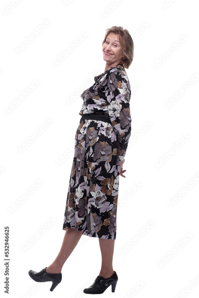 Full length portrait of adult woman 70s smiling and looking on camera Full length portrait of adult woman 70s smiling and looking on camera