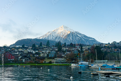 View of Spiez , Mountain Niesen , Spiez harbour . Beautiful city near Lake Thun during autumn , winter morning : Spiez , Switzerland : December 4 , 2019