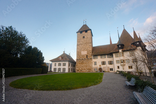 Spiez Castle , Museum , Tower . Medieval castle on the hills near Lake Thun during autumn , winter morning : Spiez , Switzerland : December 4 , 2019