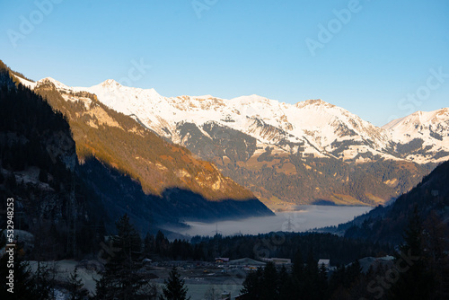 Kandersteg , resort town , village in the Bernese Oberland near Lake Oeschinen and Blausee during autumn , winter morning : Kandersteg , Switzerland : December 4 , 2019