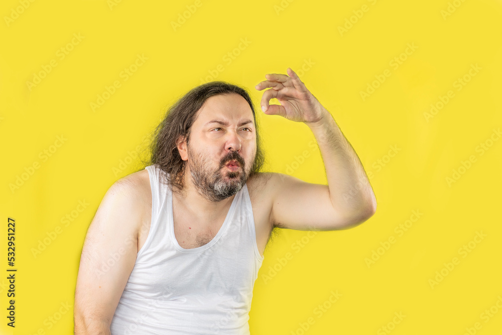 A surprised unshaven man in a white undershirt looks at something small in surprise. Template for adding an item. An unemployed, unkemptly dressed adult from Eastern Europe. A surprised unshaven man in a white undershirt looks at something small in surprise. Template for adding an item. An unemployed, unkemptly dressed adult from Eastern Europe.