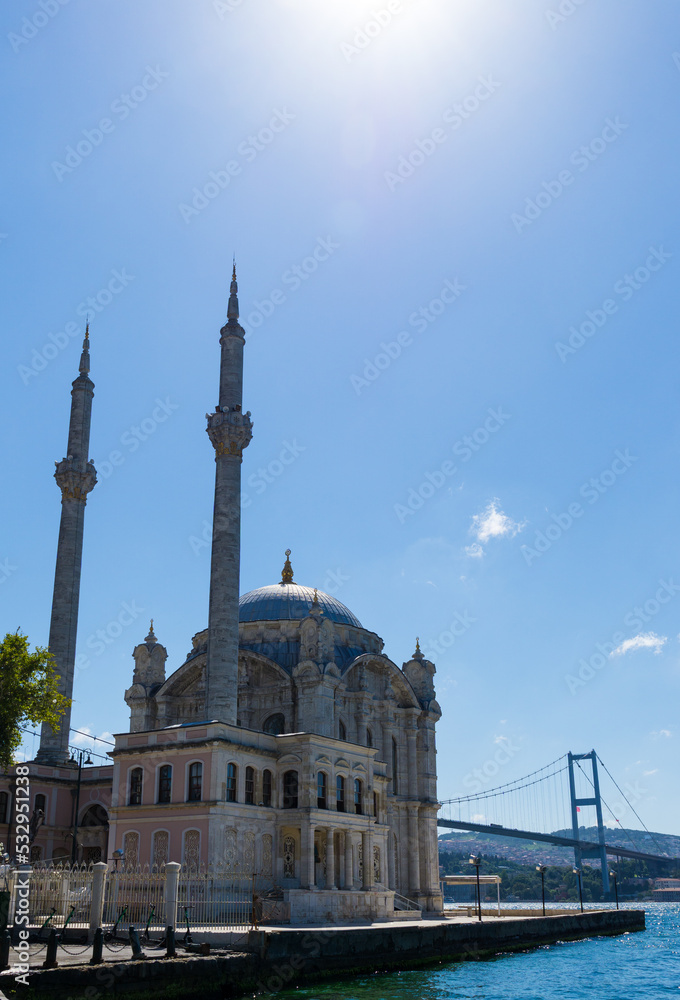Ortakoy Mosque in Istanbul with the bosphorus bridge on a sunny day