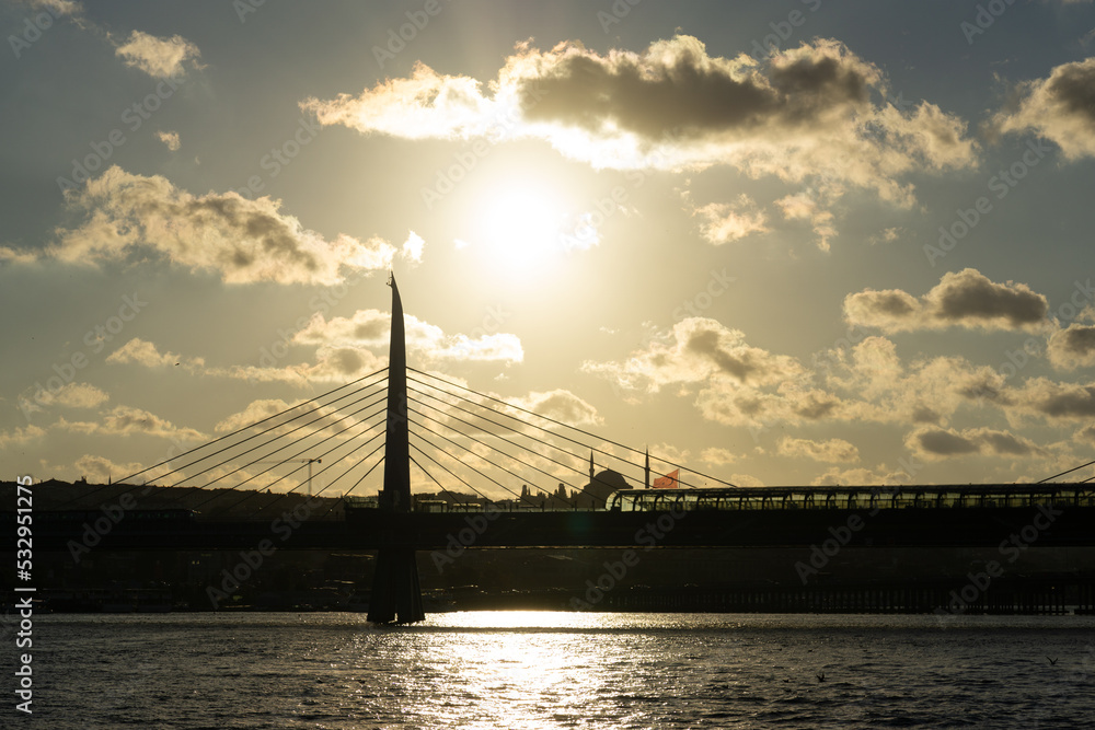 Fototapeta premium Sunset in Istanbul with bridge and clouds
