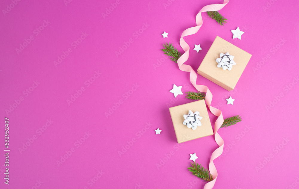 Christmas holiday greeting card with little gift boxes, stars and fir branches, pink trendy background