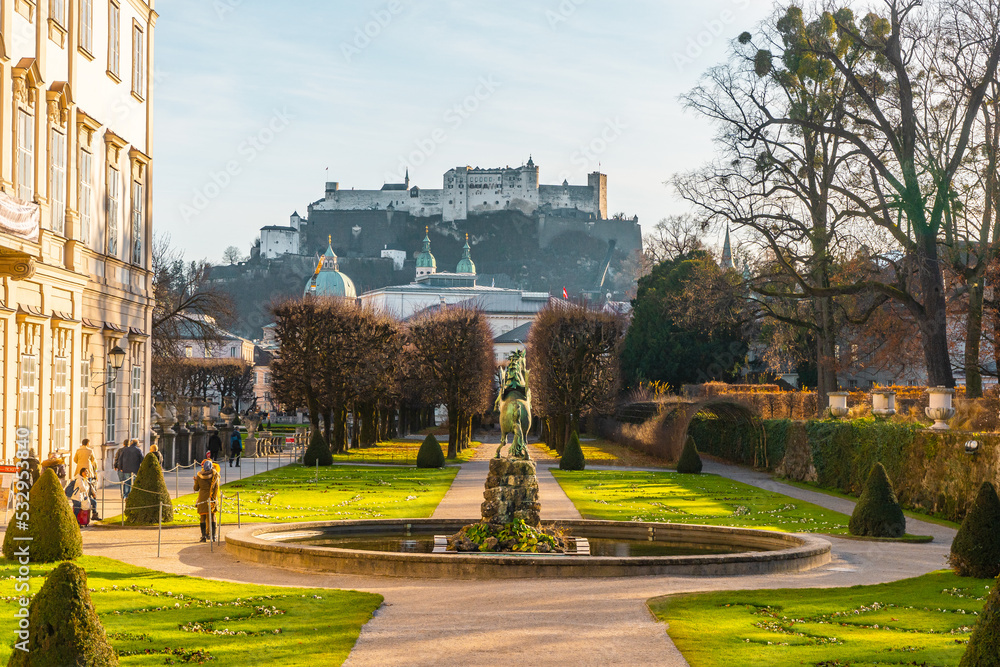 Fototapeta premium Mirabell Palace and Baroque Garden in old town of Salzburg with Hohensalzburg during autumn , winter morning : Salzburg , Austria : December 9 , 2019