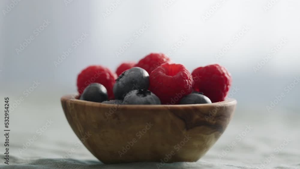 Fresh berries in bowl on linen napkin Fresh berries in bowl on linen napkin