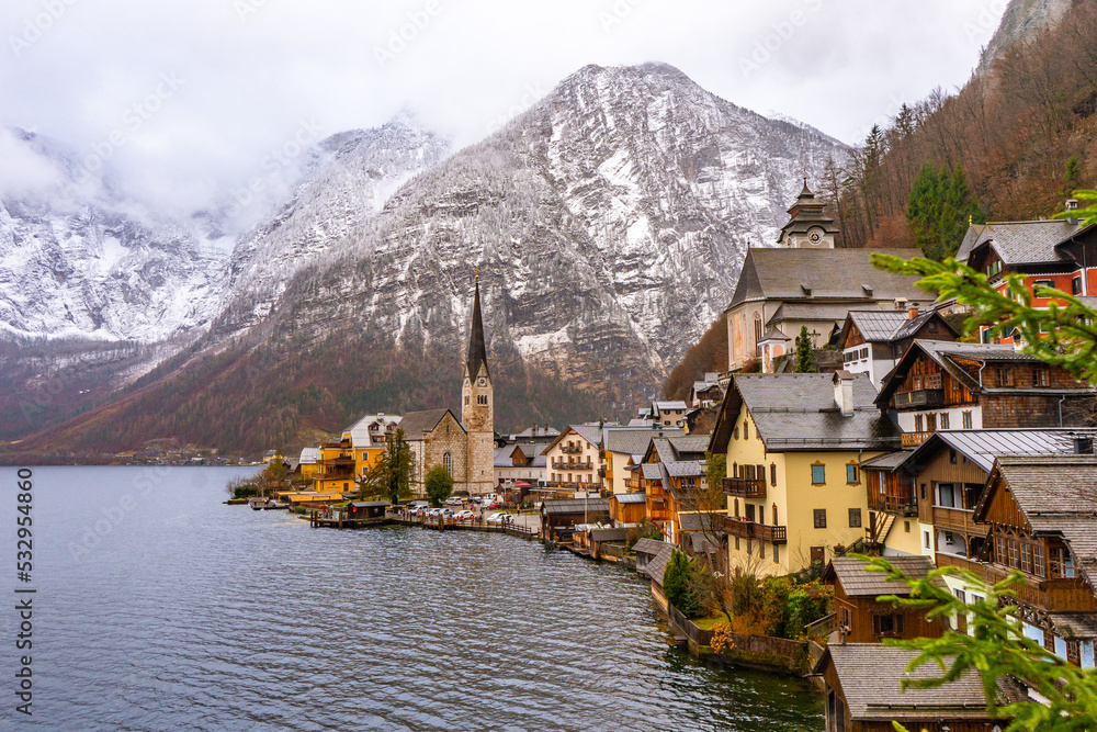 Fototapeta premium Panoramic classic view at Hallstatt , Unesco Romance town at Lake Hallstatt and Salzkammergut during winter cloudy day : Hallstatt , Austria : December 10 , 2019