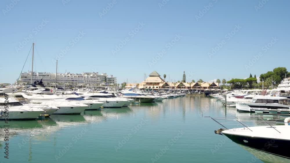Vilamoura, PORTUGAL: September 18 2022: View of luxury port of Vilamoura. Algarve region. Luxury travel destination in South of Portugal. Yacht docked, restaurants, luxury hotels and urbanisations. Vilamoura, PORTUGAL: September 18 2022: View of luxury port of Vilamoura. Algarve region. Luxury travel destination in South of Portugal. Yacht docked, restaurants, luxury hotels and urbanisations.