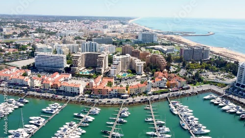 Vilamoura, PORTUGAL: September 18 2022:. Beautiful aerial perspective of Vilamoura marina. Luxury urbanisations, yachts docked in the port. Famous travel destination in Algarve, south of Portugal photo