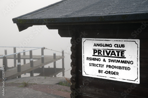 Private fishing and swimming sign at lake in Kilmacolm photo