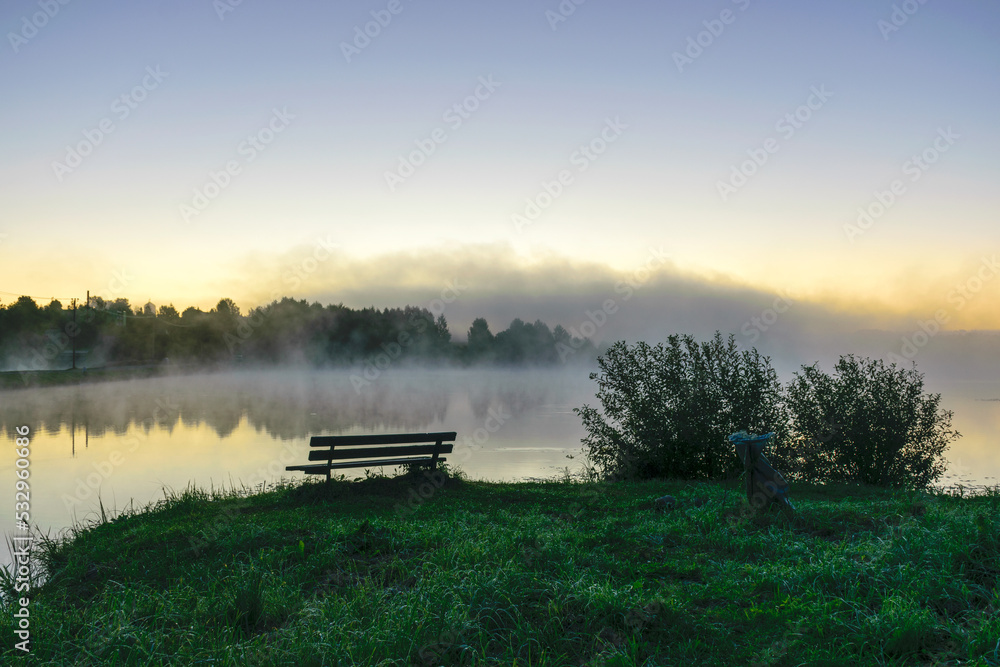 autumn morning by the lake, fog over the surface of the water, a moment before sunrise autumn morning by the lake, fog over the surface of the water, a moment before sunrise