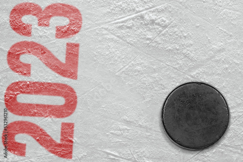 Hockey puck on the ice arena