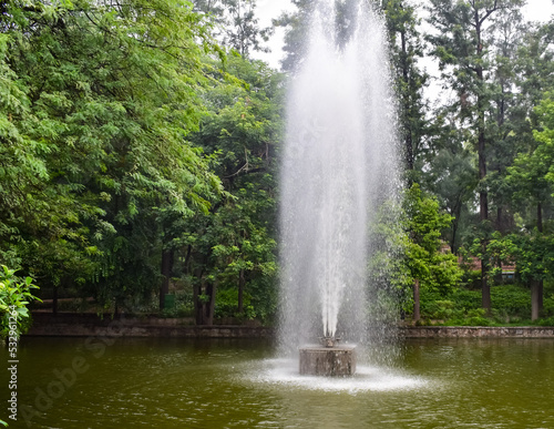 Fountain in the complex of Lodhi Garden in Delhi India, working fountain in the Lodhi Garden complex, water in the fountain, fountain in the Lodhi Garden park during morning time