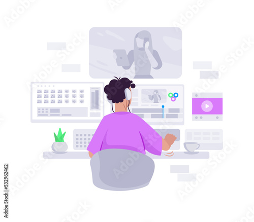 Video editor sitting at computer desk and creating project