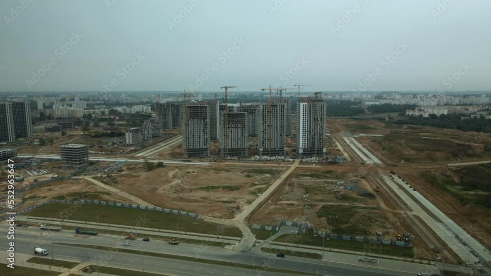 Modern urban architecture. Multi-storey buildings with infrastructure. Construction site of a new city block. Overcast weather. Aerial photography. Modern urban architecture. Multi-storey buildings with infrastructure. Construction site of a new city block. Overcast weather. Aerial photography.