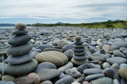 Zen towers on a rocky beach.