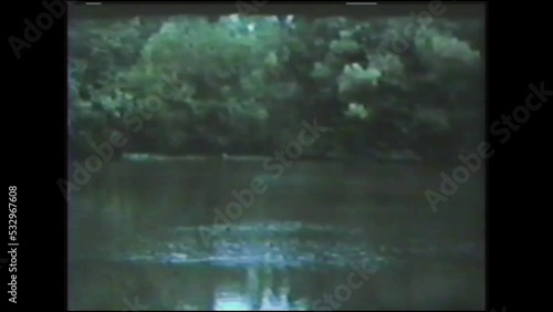 1960s: Details of a small dam on a river. Vintage Video